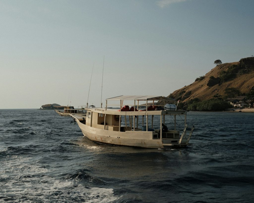 A small boat in the middle of a body of water